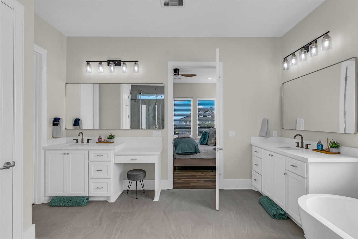 Costa Cristal Primary Ensuite: A bright, modern bathroom featuring a large mirror that enhances light and adds a sense of spaciousness.