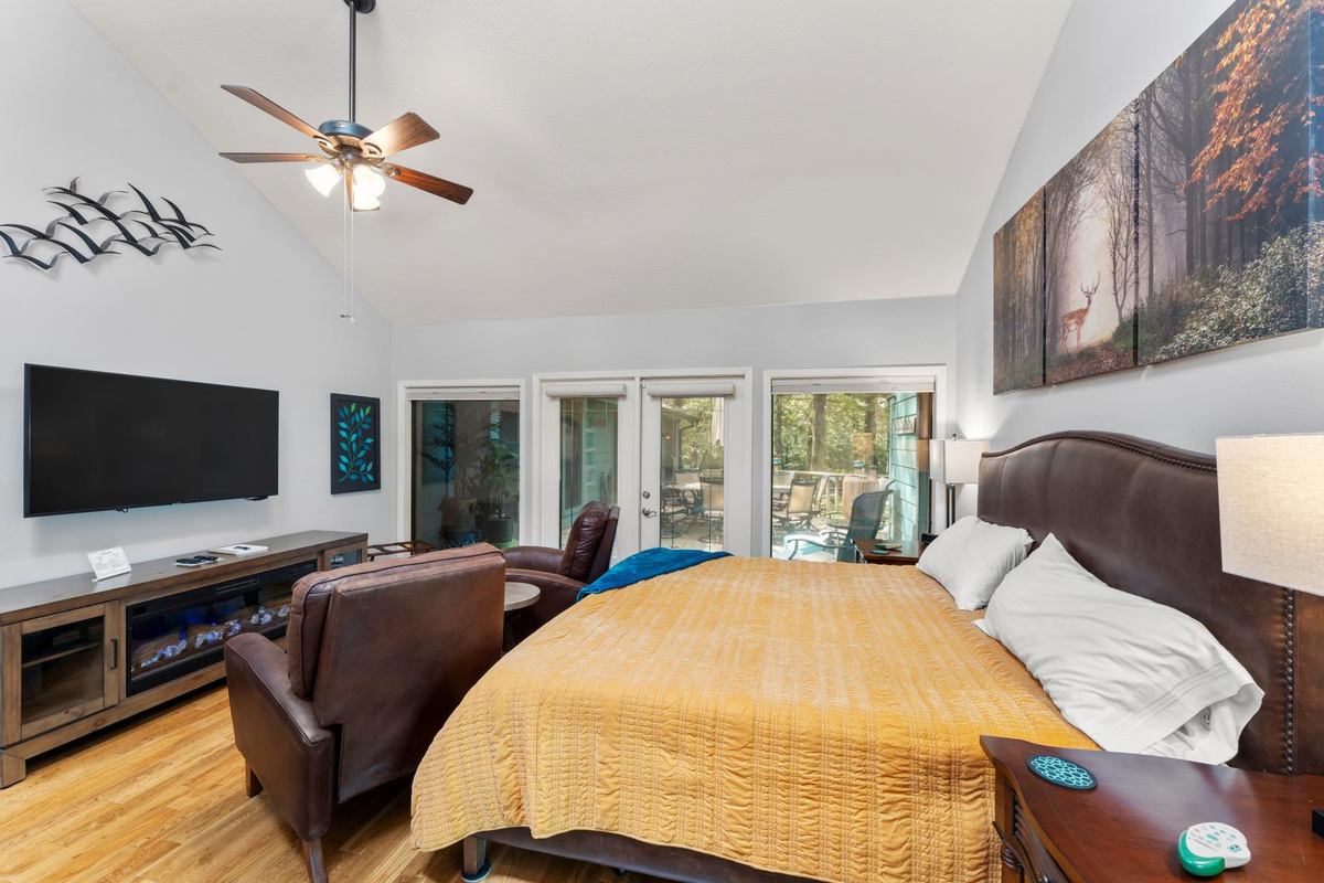 King 2 -  offering a glimpse of the back deck and the room's private outdoor area. This inviting view highlights the seamless indoor-outdoor connection, perfect for relaxation and privacy.
