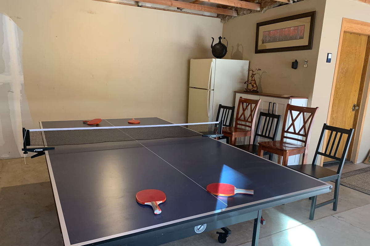 Bring your competitive side for some ping pong! An outdoor fridge provides plenty of space for your drinks. 