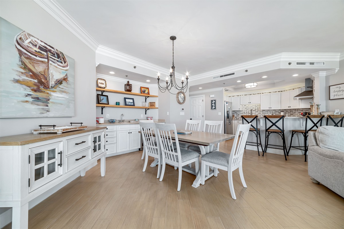 Enjoy effortless entertaining with this well-appointed dining area and wet bar. The integrated wine cooler and blender provide added convenience, while the contemporary design enhances the overall aesthetic.