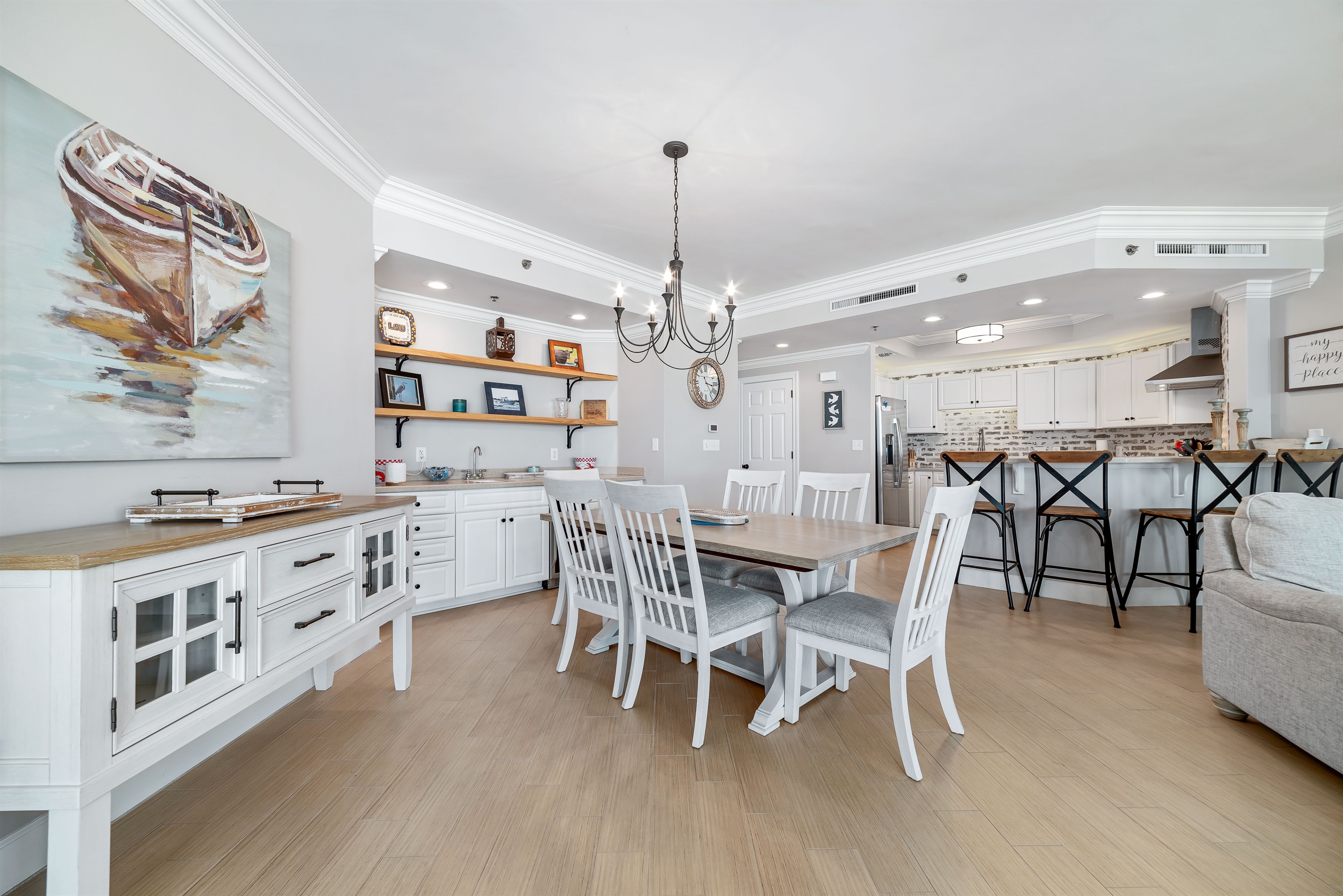 Enjoy effortless entertaining with this well-appointed dining area and wet bar. The integrated wine cooler and blender provide added convenience, while the contemporary design enhances the overall aesthetic.