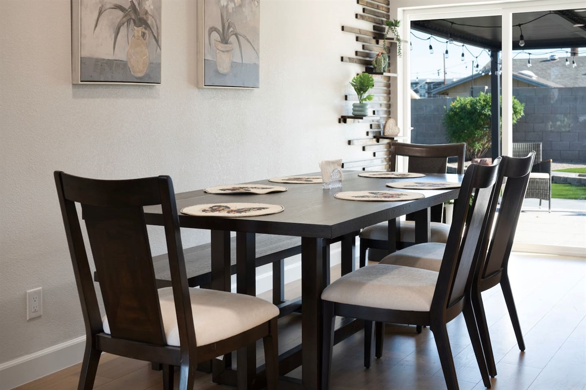 Spacious dining area with seating for six, perfect for shared meals, game nights, and gathering together