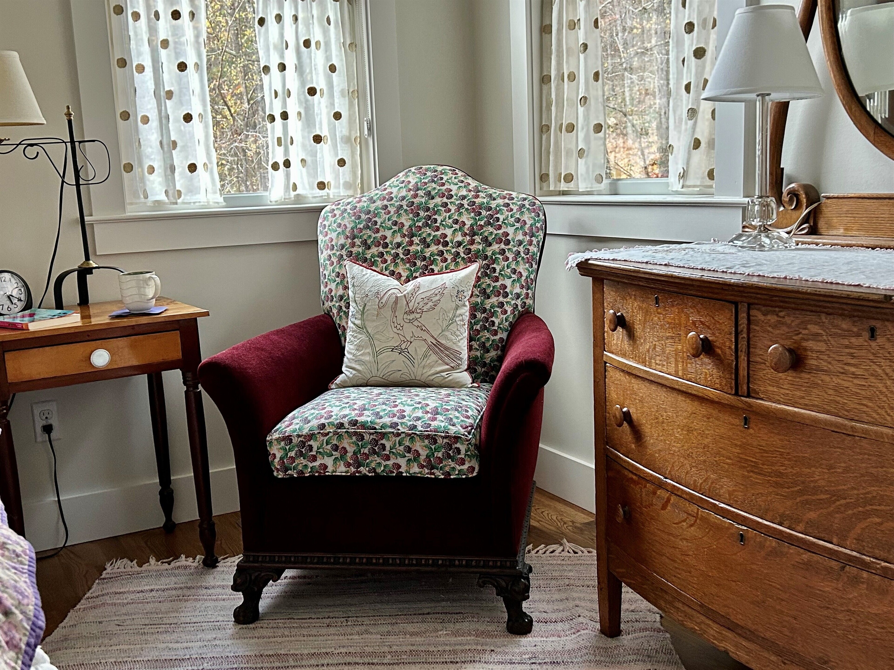 Cozy lounge chair creates lovely reading spot in the main bedroom. Great light!