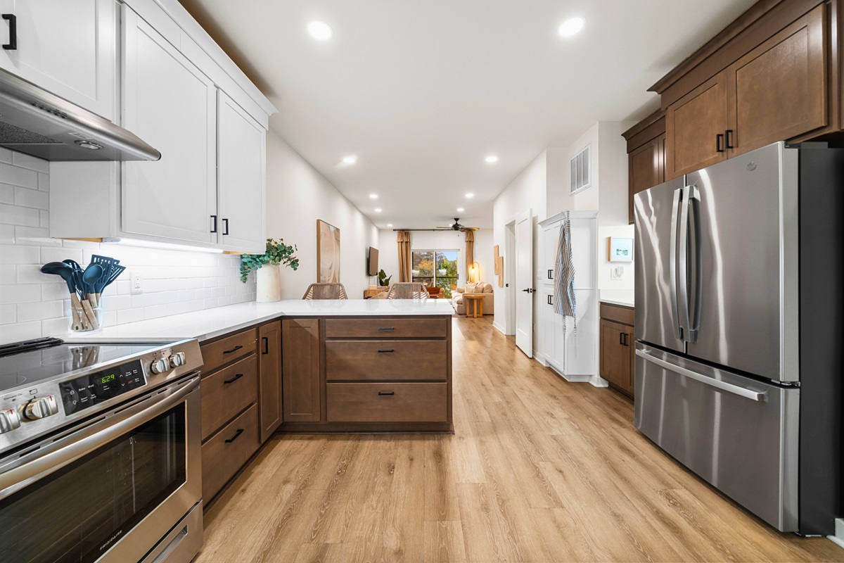Bright, open-concept kitchen with stainless appliances and plenty of counter space.