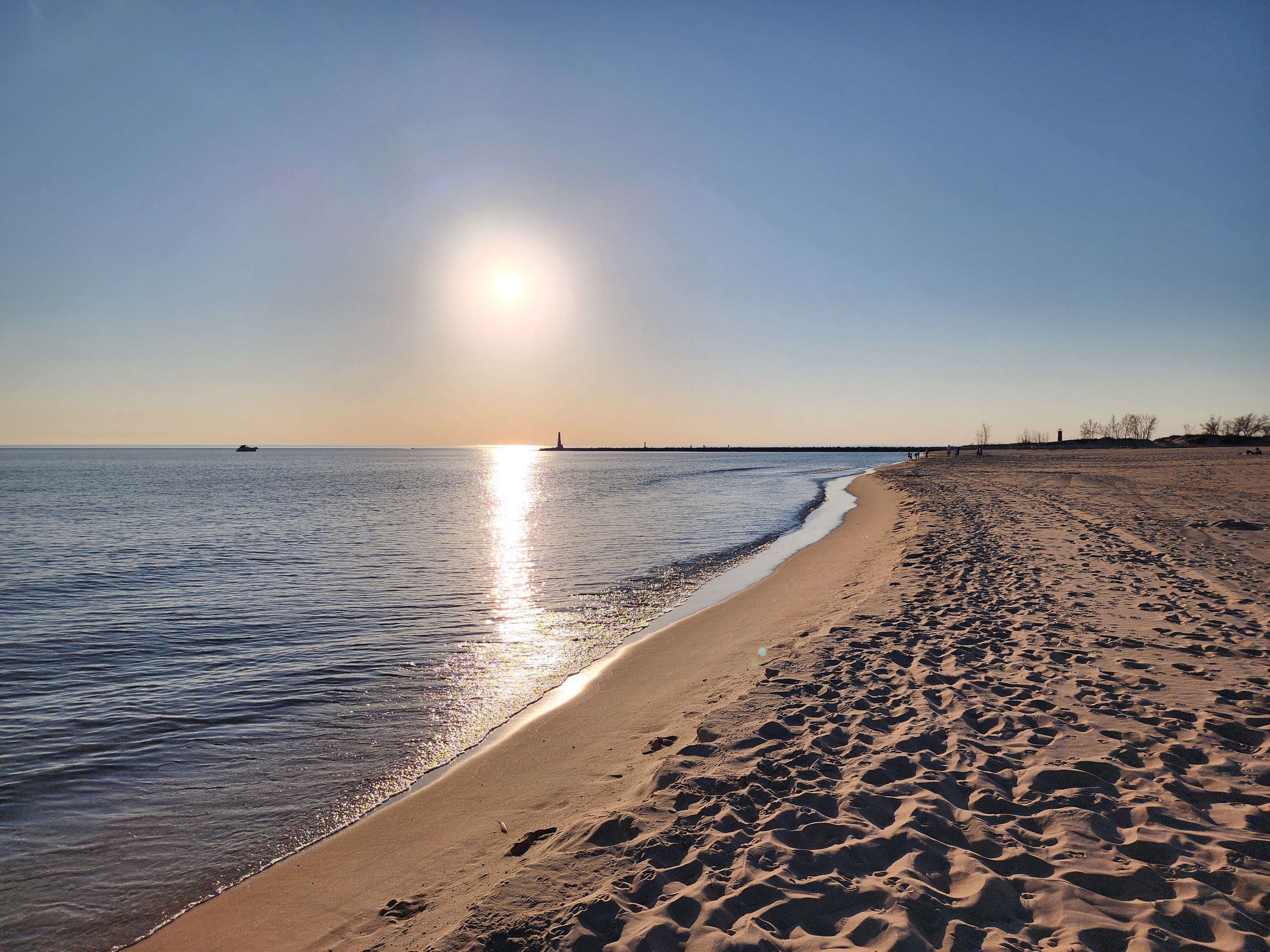 Pere Marquette Beach just minutes from the home offers soft sands, clear water, and unforgettable sunsets