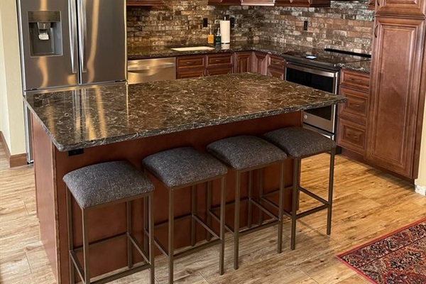 Kitchen with quartz counter tops and an induction range