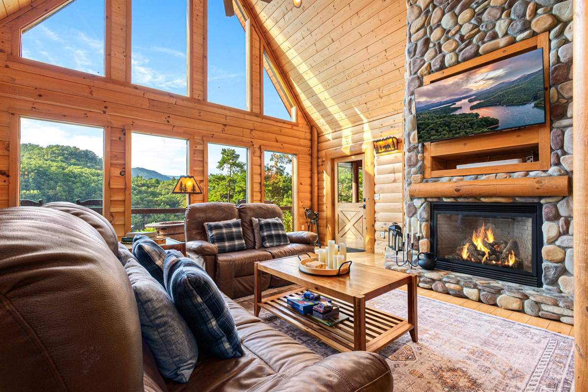Main Level Living Room: Stunning views and rustic charm await you in this inviting space! Relax by the fire.