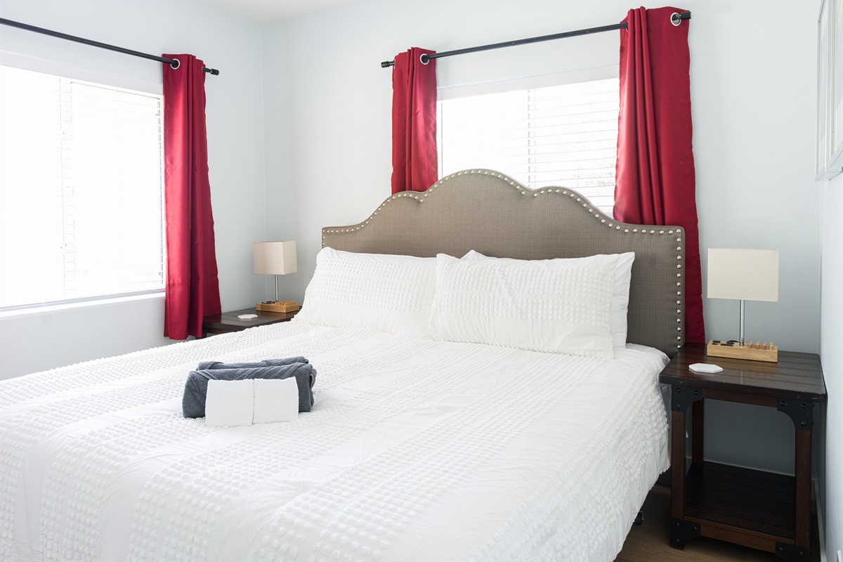 King bed with closet space and blackout curtains