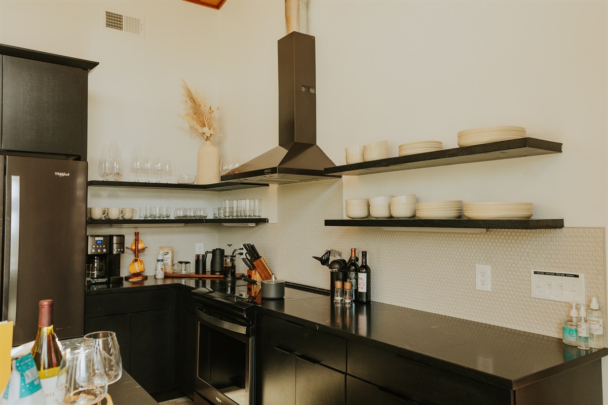 {Glass House Kitchen} Chef's Kitchen with servings for all of your guests.