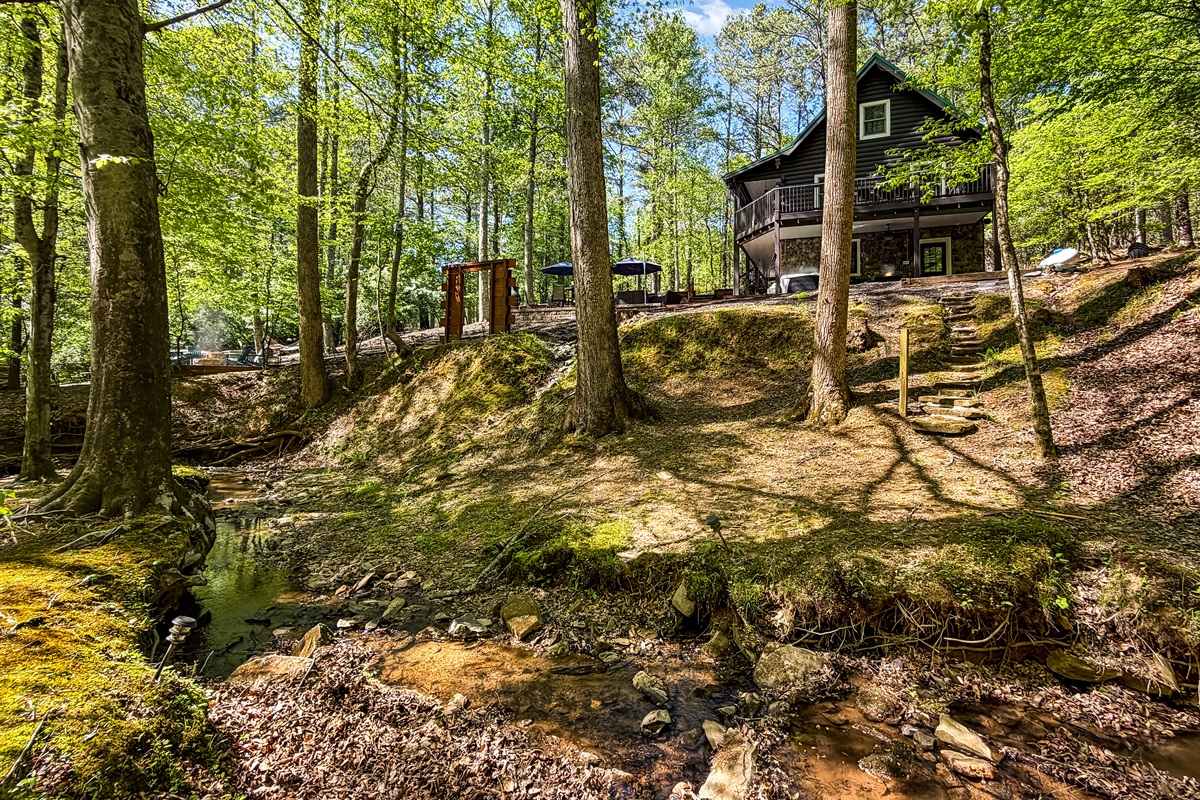 A serene waterfront retreat with stream views. Perfect for rest, restoration, and meaningful moments.