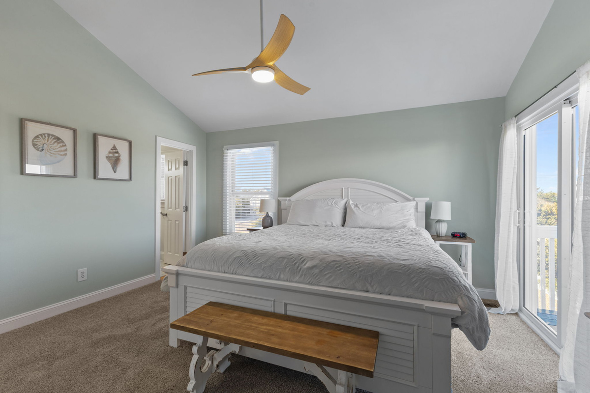 Master bedroomDrift off in this spacious king master suite featuring vaulted ceilings, soft coastal colors, and your own private balcony