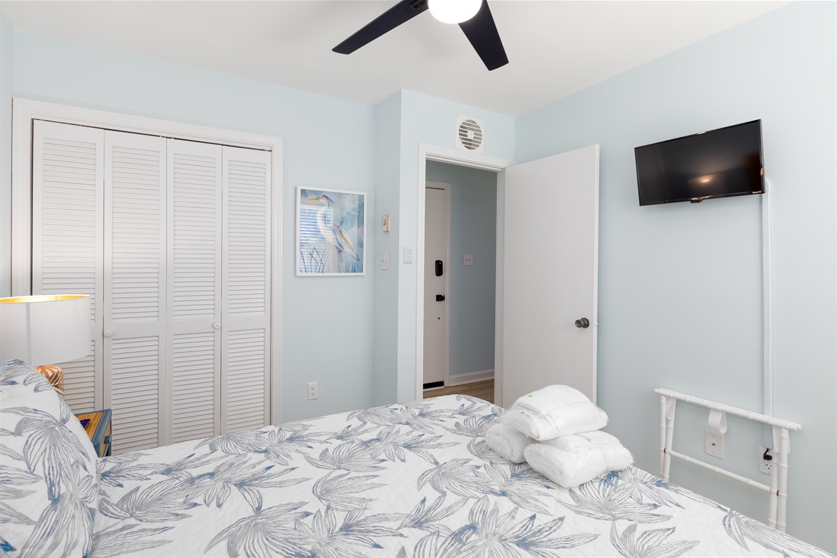 TV and luggage rack in bedroom