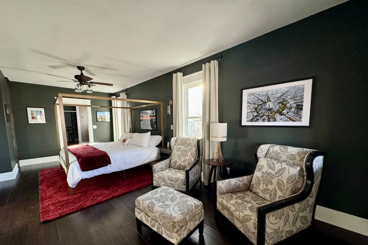 The Upper Level Paris Suite offers a King Bed, sitting area, ensuite bathroom and even partial views of the lake.