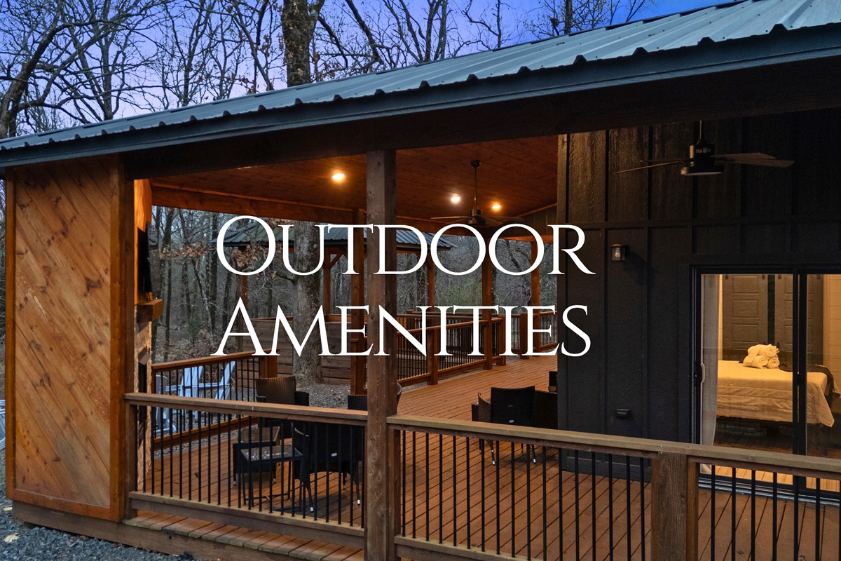 Stepping out onto this covered deck instantly feels like a breath of fresh air, with plenty of space to relax in the woods.