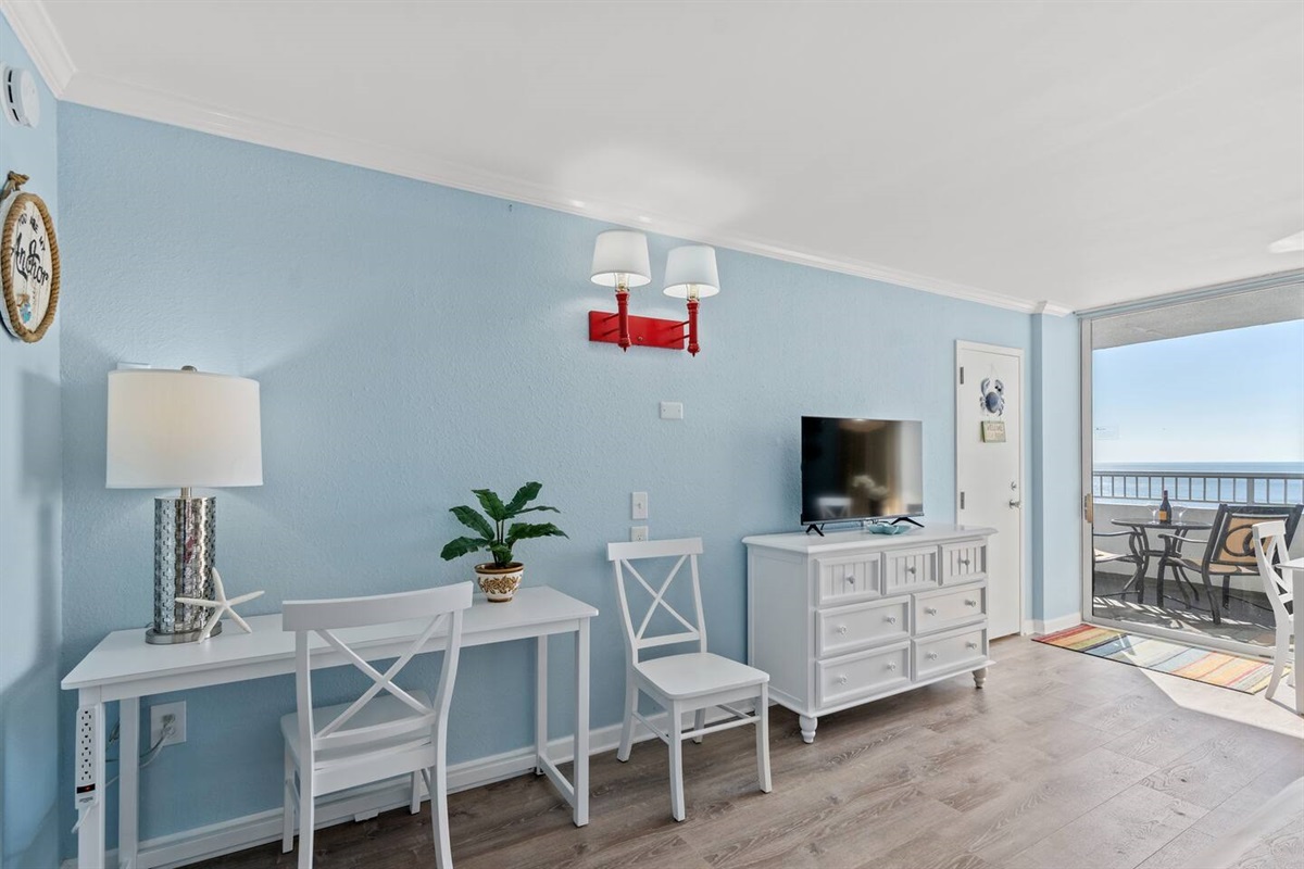 A dedicated desk area with multiple outlets built into the desk. This space can also double as a vanity, with a tabletop vanity mirror available within the unit should your partner be hogging the bathroom :) 