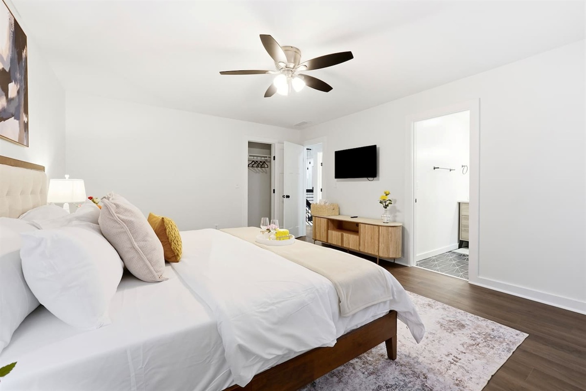 Cozy second-level bedroom featuring a king bed, a Roku-powered Smart TV, and located at the end of the hallway to the left at the top of the staircase. This room includes 2 full-body towels, 2 washcloths, and 2 hand towels for your stay.