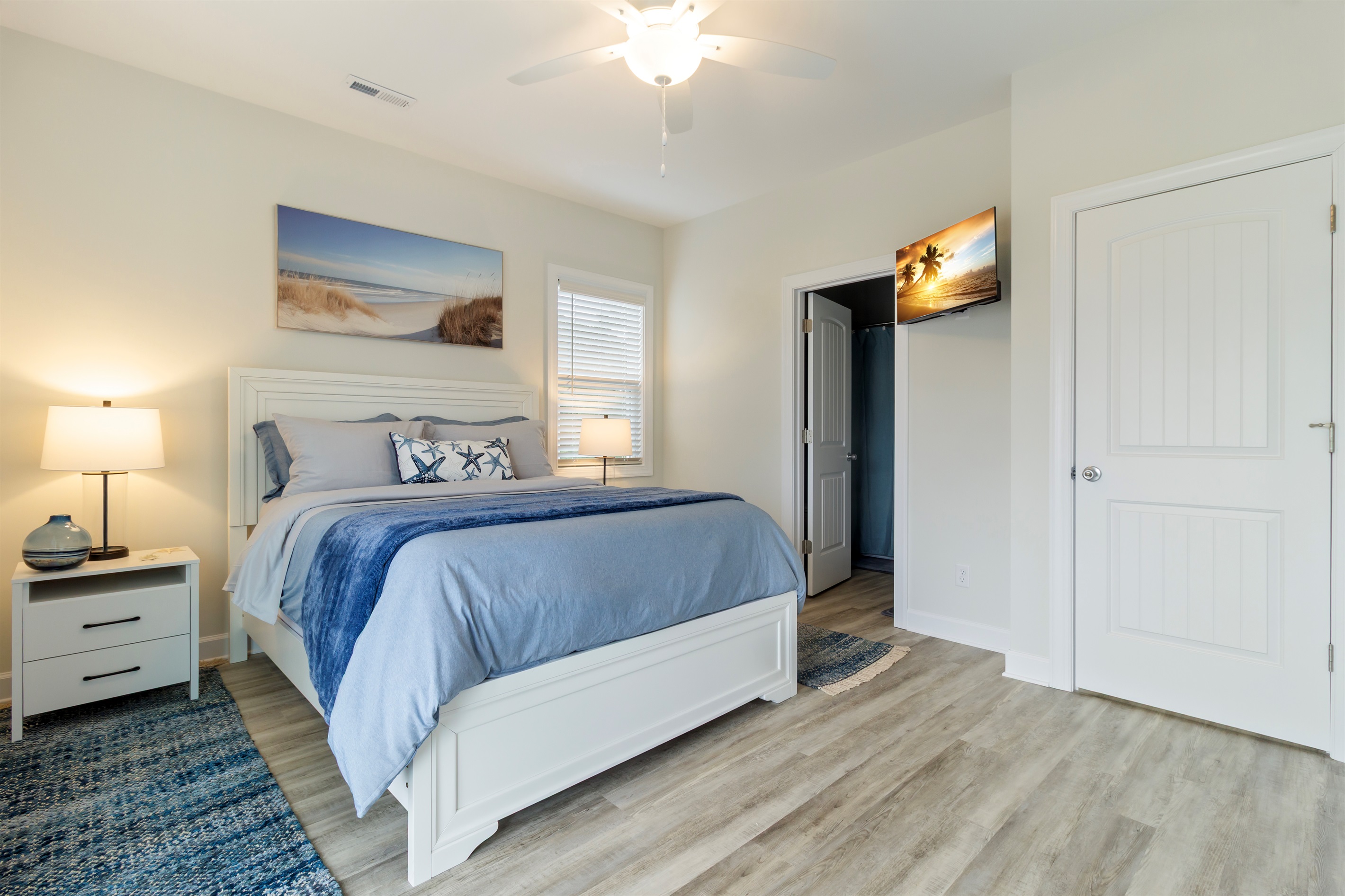 Bedroom 1 - Master with queen bed, ensuite bathroom, and private balcony