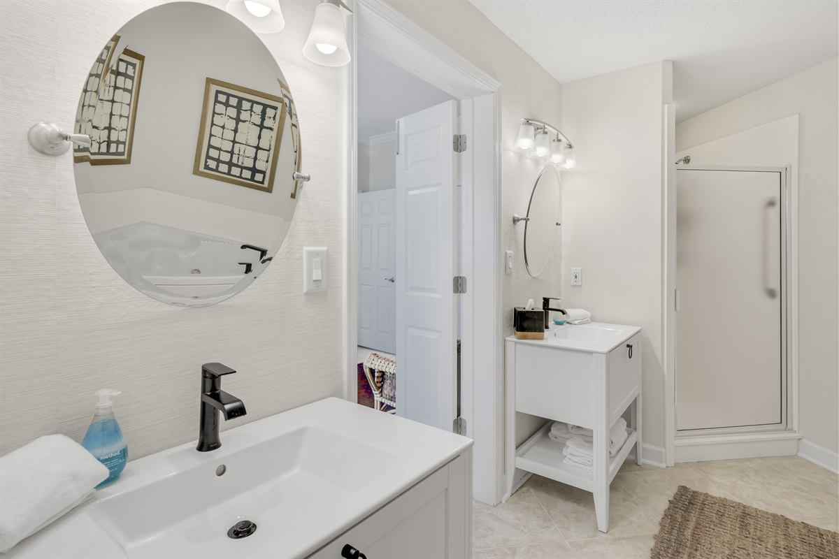 Enjoy a deep soaking tub, dual sinks, and a walk-in shower—designed for comfort and convenience.
