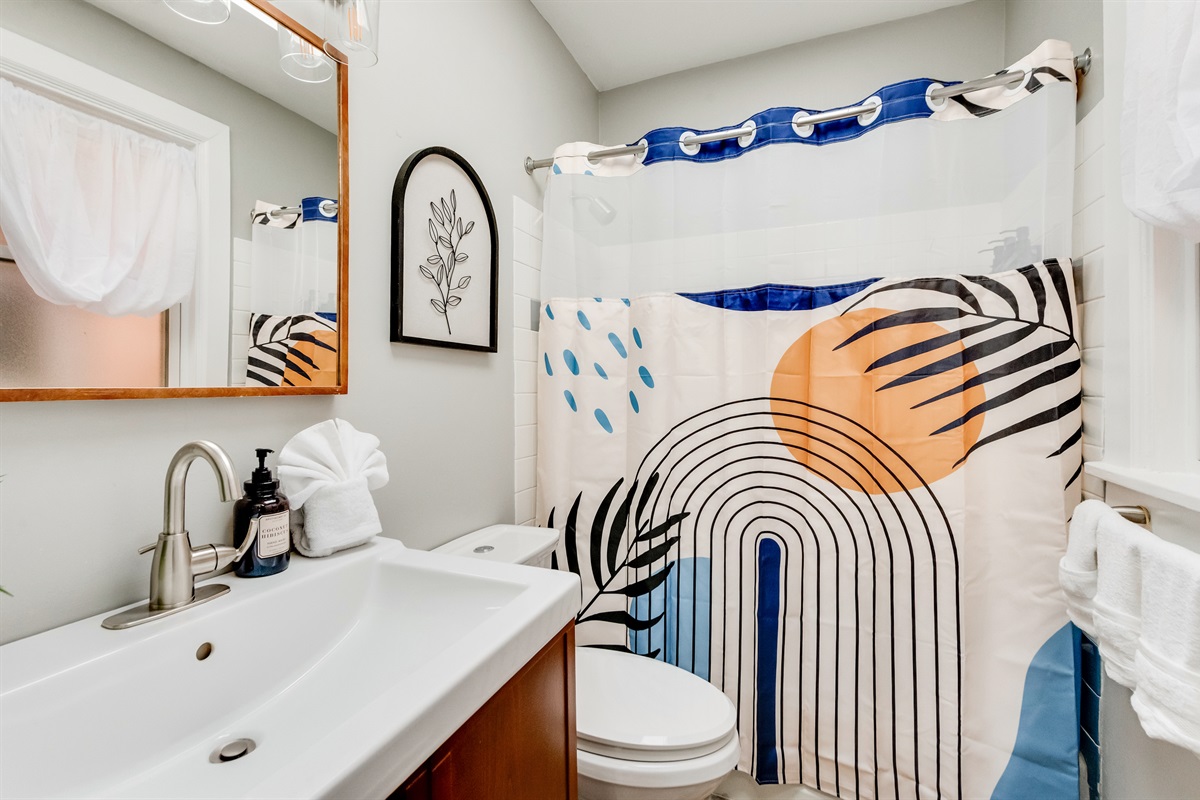 Bath Oasis: Vibrant decor and modern fixtures create the perfect refreshment retreat!