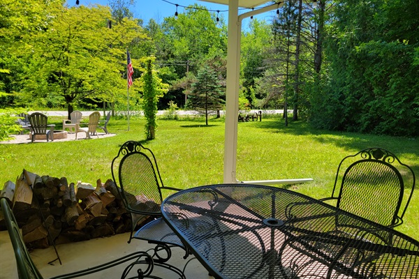 Main Porch: covered, seating for 6+, charcoal grill, string lights, close to the fire pit