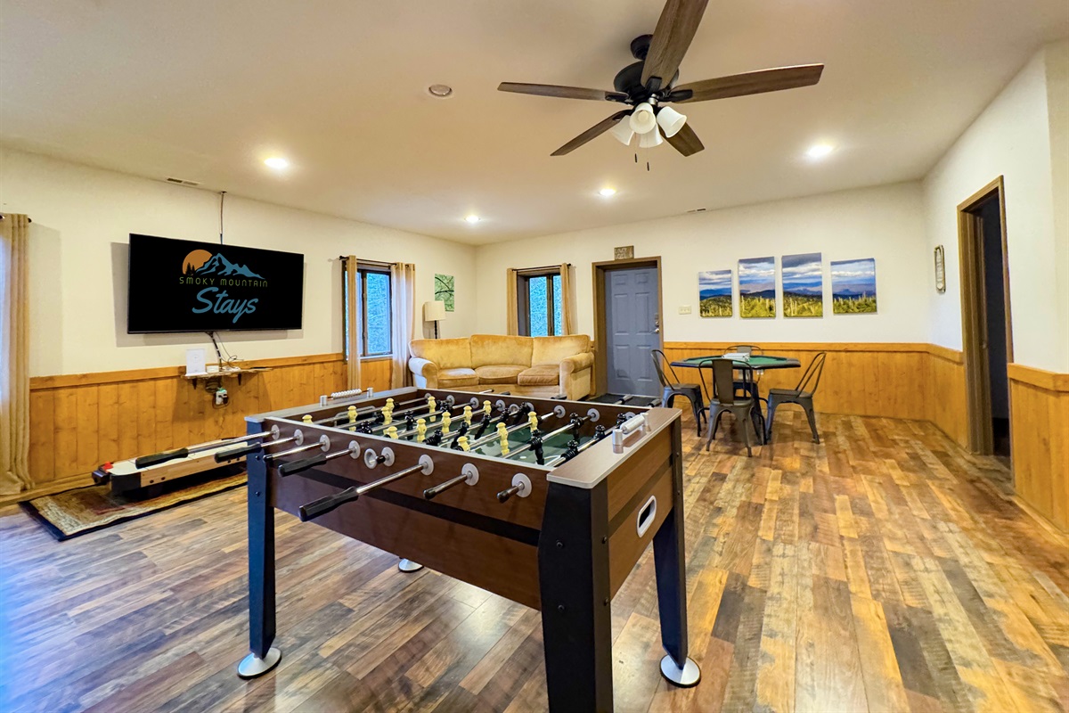 Our game room features foosball, ping pong table, ring toss, card table, kids's air hockey(floor model), Smart TV, kitchenette, bathroom, sauna, and more.
