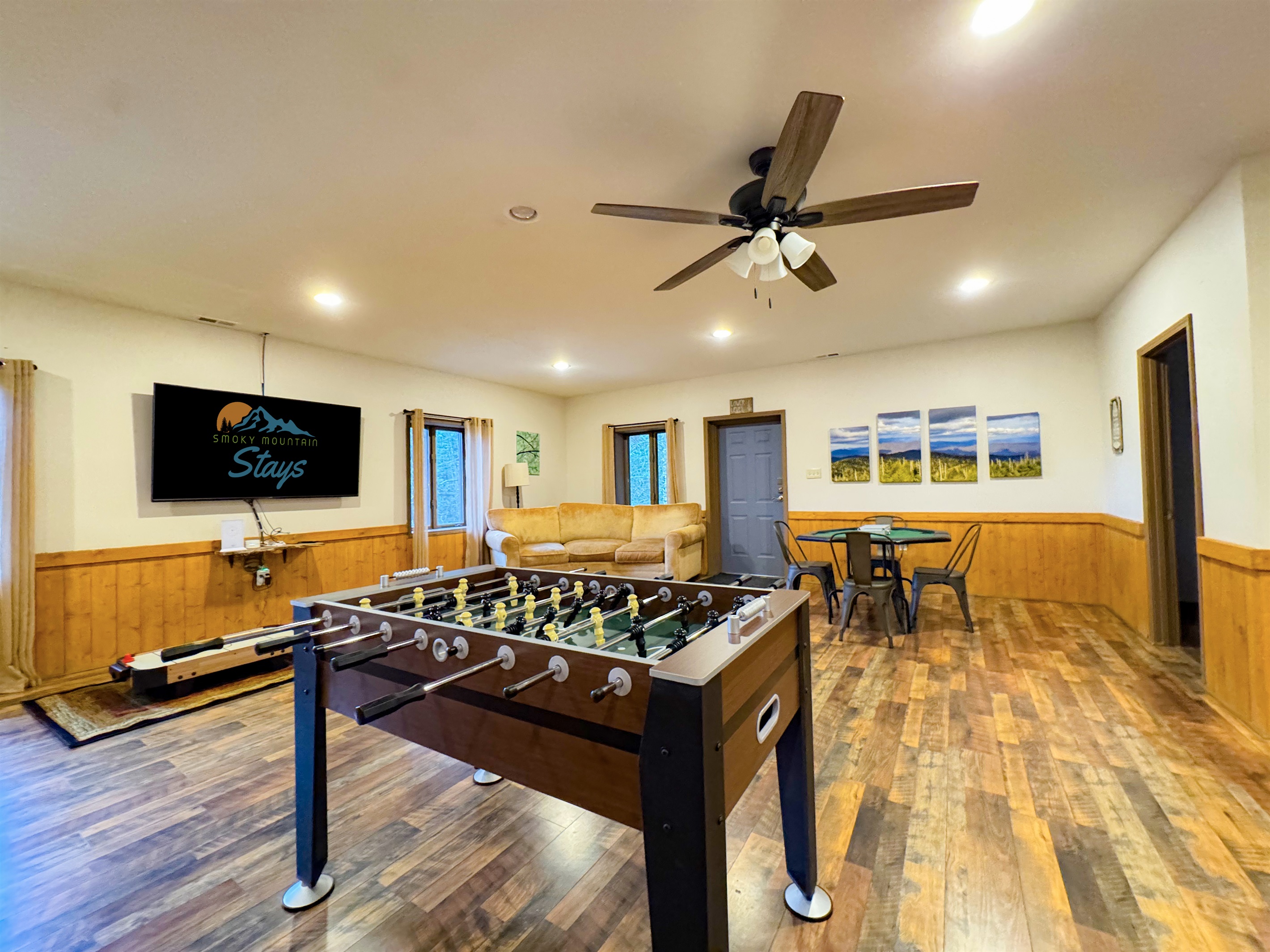Our game room features foosball, ping pong table, ring toss, card table, kids's air hockey(floor model), Smart TV, kitchenette, bathroom, sauna, and more.