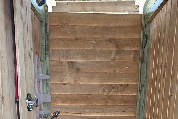 Shower seat with ample space for cleaning.
