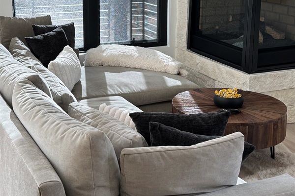 Warm your feet by the fireplace on the comfy West Elm couch