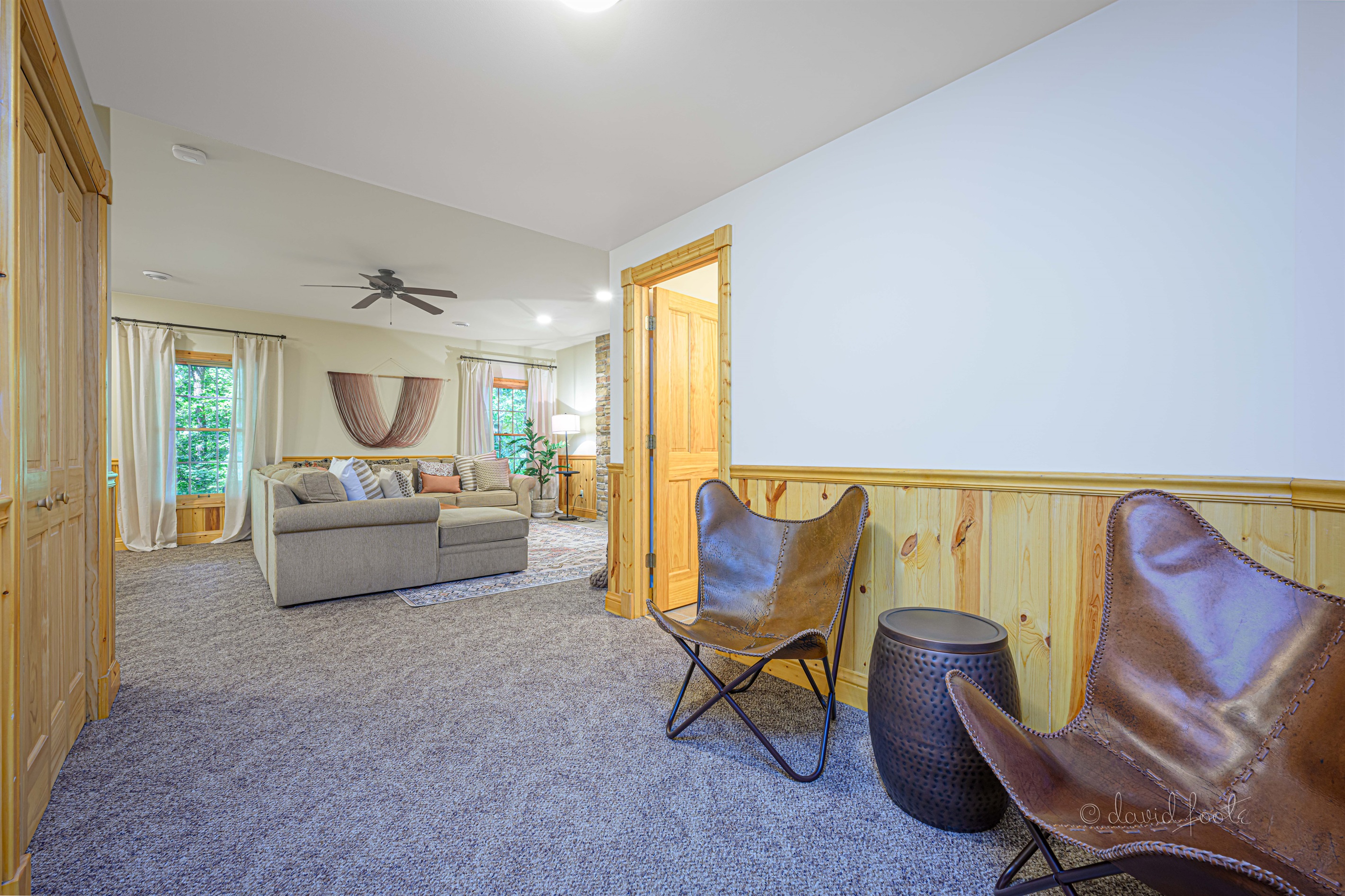 Two leather chairs provide another space to catch up and relax