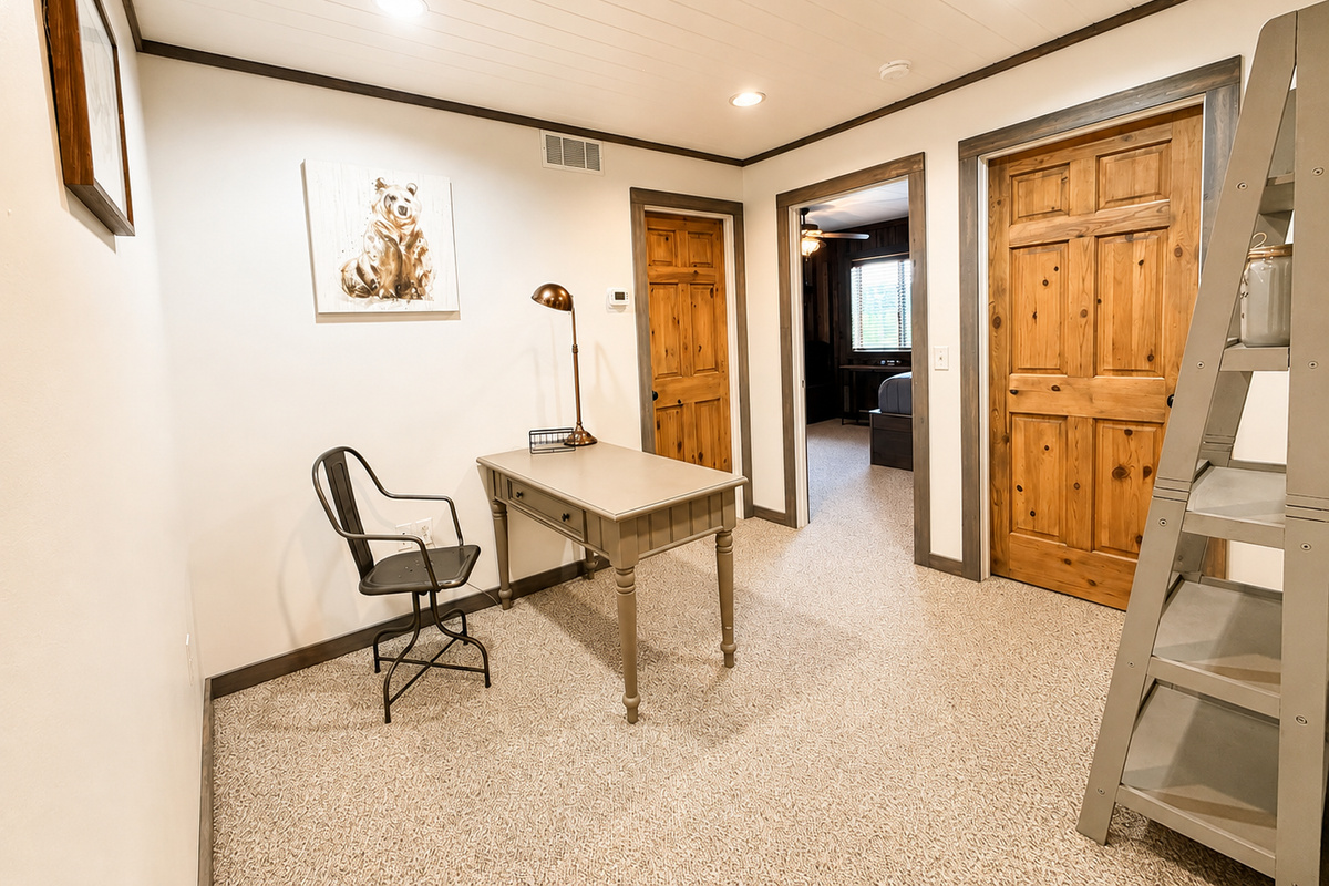 At the top of the stairs, this landing connects three private bedrooms and includes a handy desk/workspace—an easy, functional layout that gives your group convenient access to the upstairs sleeping areas.