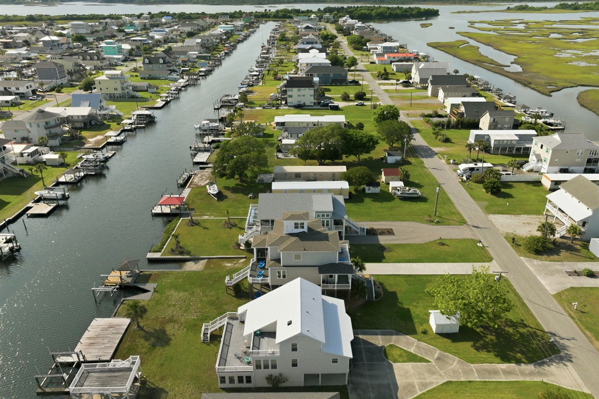 Nestled between the canal and coastal marshlands, this home offers unforgettable water views in every direction