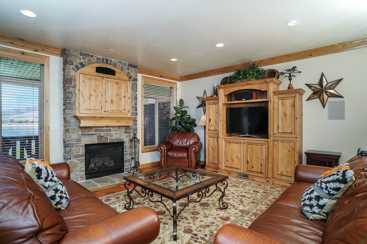 Spacious gathering area with plush seating and entertainment center—ideal for movie nights.
