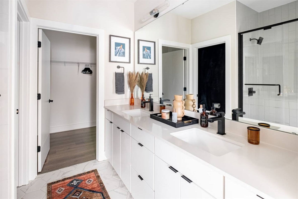 Double vanity with his and her sinks in this full bathroom right off the king suite. Complimentary amenities and essential toiletries provided.