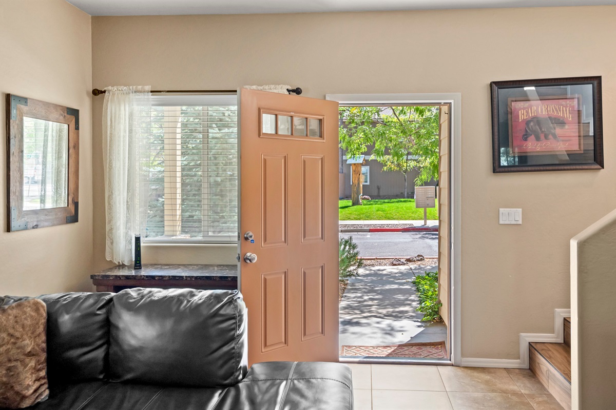 A discreet workspace behind the couch offers a perfect spot for jotting down travel plans or remote work.