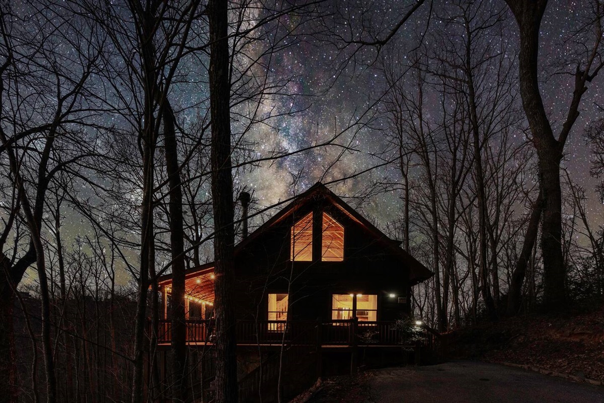 Our mountain cabin at dusk.  View is from the driveway.  The porch on left is westward facing for a beautiful view of sunset