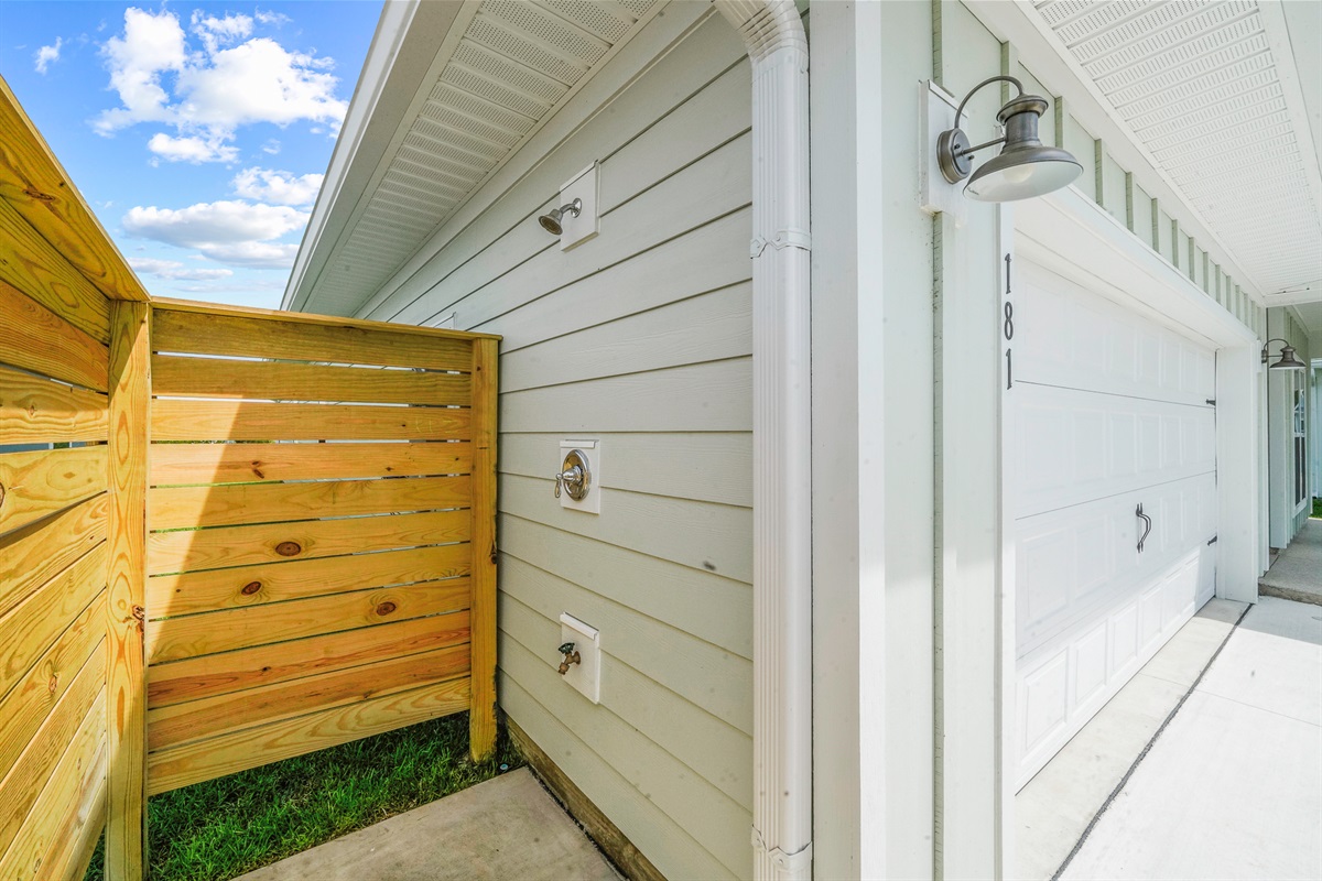 Outdoor shower available to rinse off sand before heading inside.