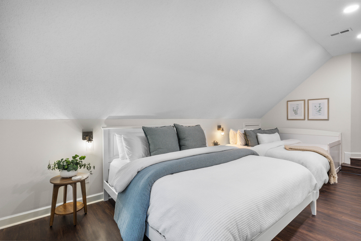 Bedroom #2 on second floor has 2 beds - 1 King bed & 1 daybed made with 2 twin mattresses next to near other