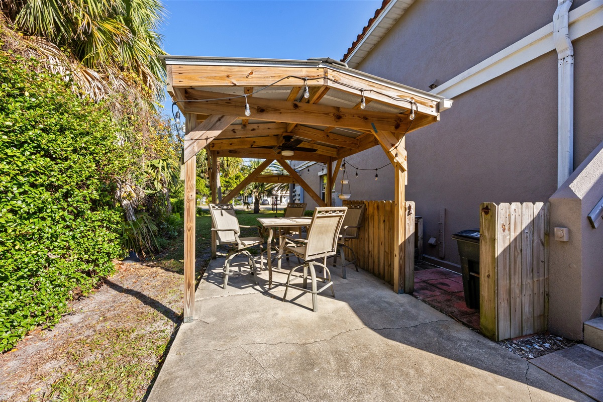 Covered patio area with shaded sitting space