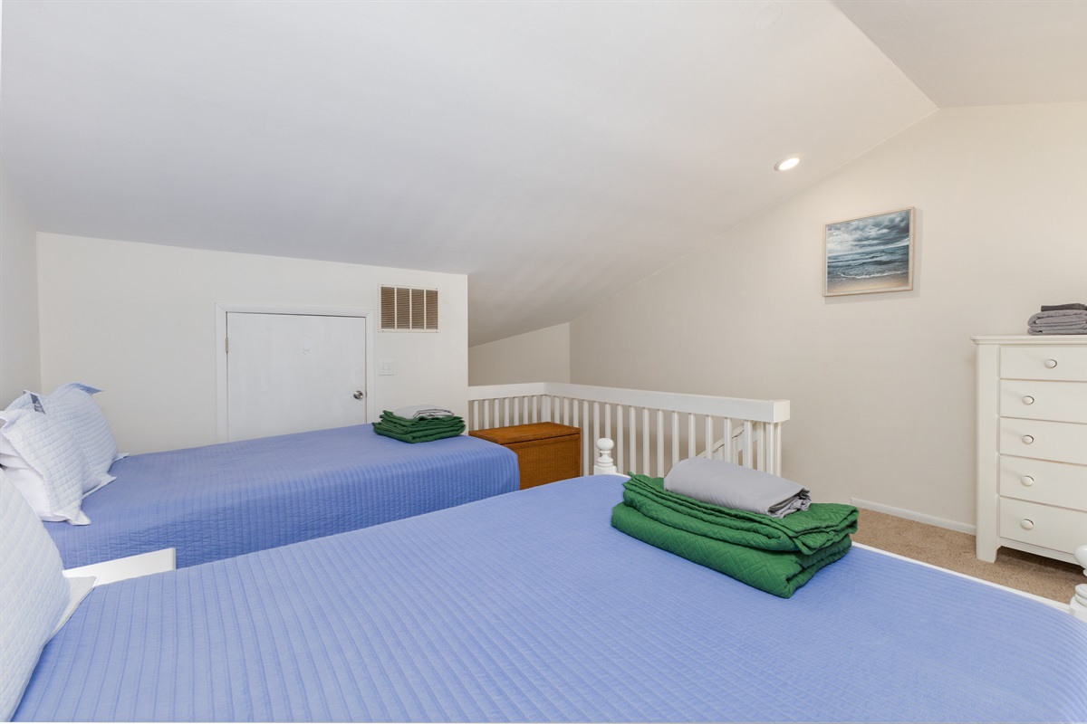 Freshly made Twin beds await in the loft