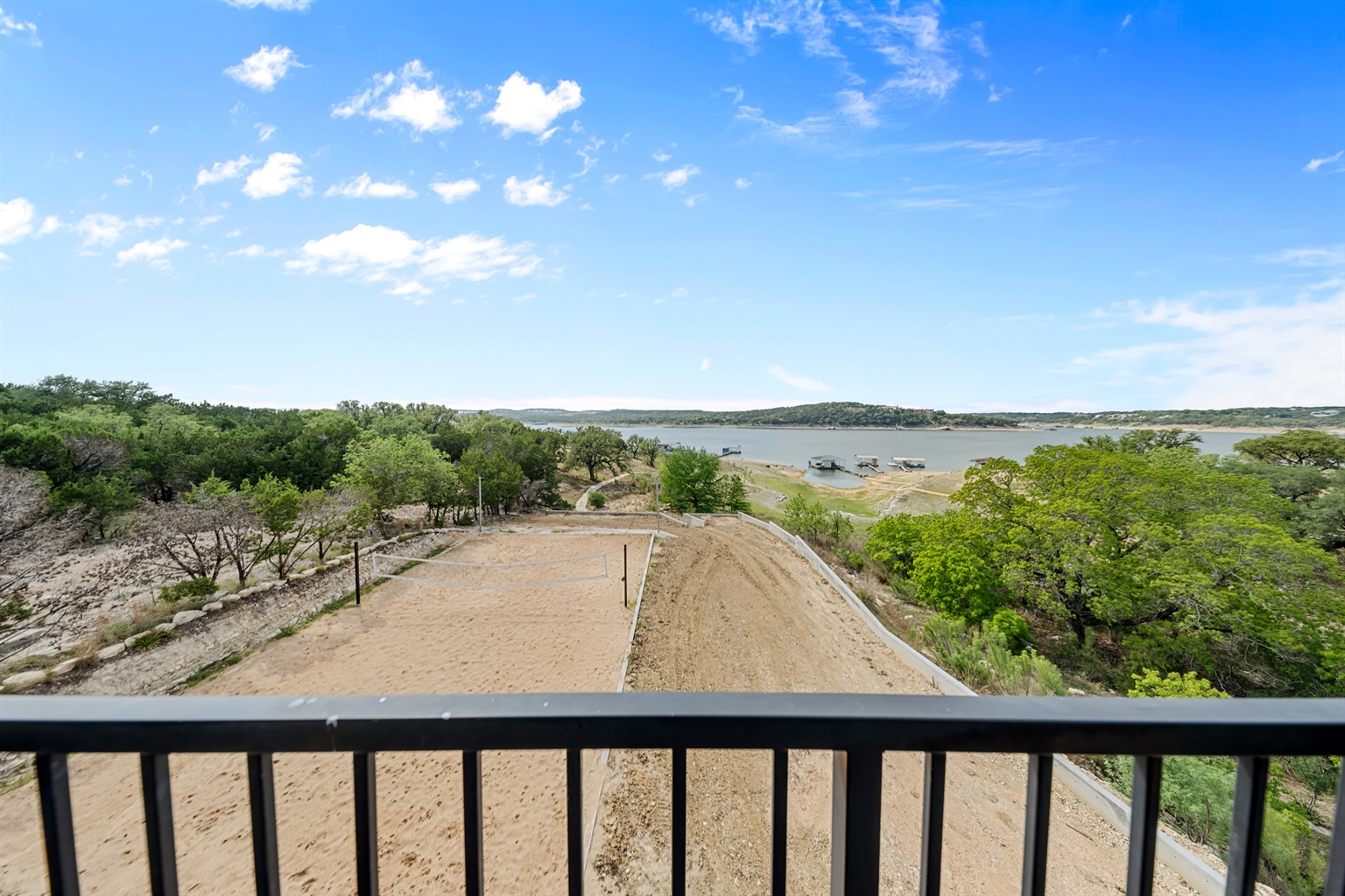 - Scenic sand volleyball court sits beside beautiful sweeping lakeview - Fun spot for friendly games smiles and active vacation energy - Open outdoor design adds excitement connection and joy to your stay