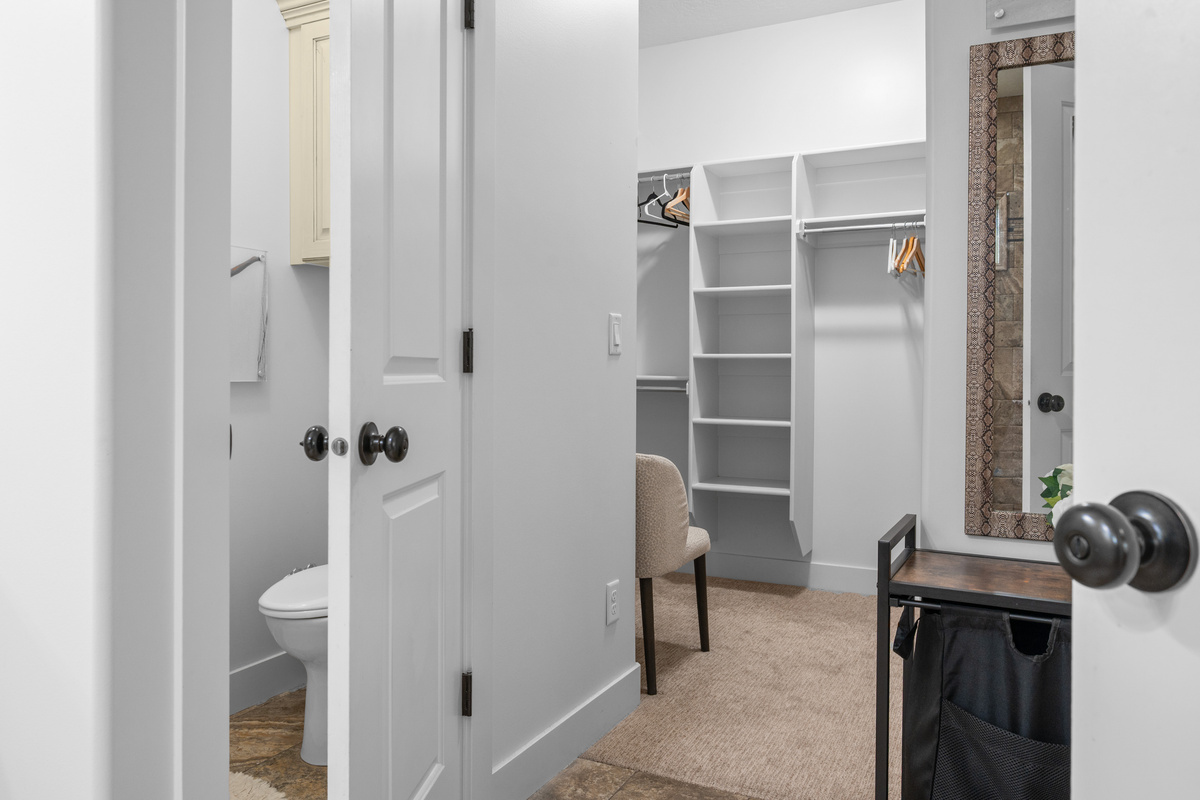 Oversized walk-in closet in the primary suite with custom shelving and plenty of storage for extended stays.