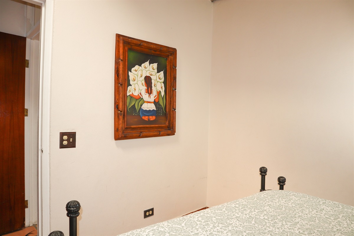 Circa Del Mar - Upstairs Bedroom 3 with a Queen bed with Wesley Allen headboard and open-toe foot posts.