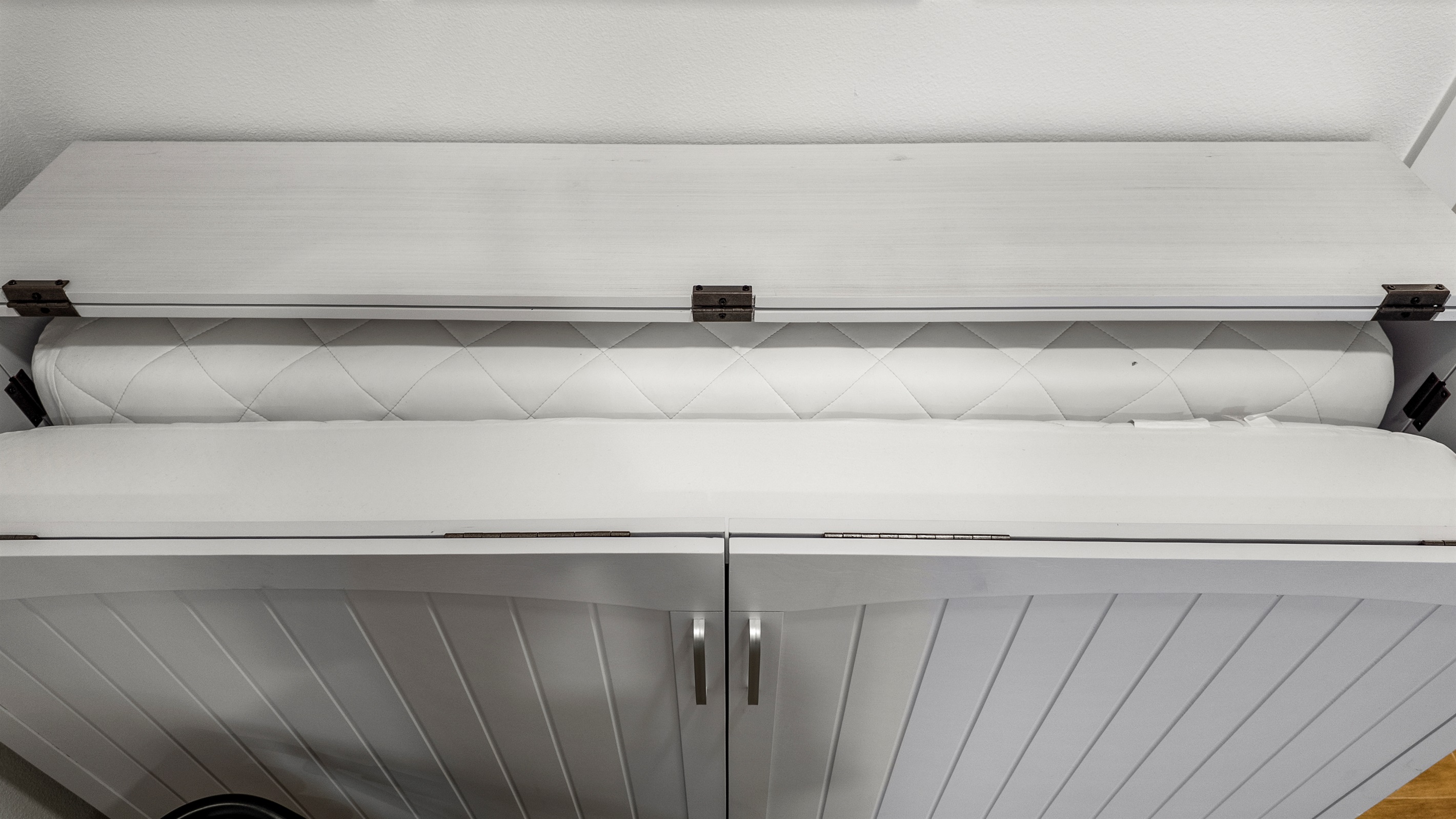 The Pleasure Pier Guest Suite murphy bed easily makes into a comfortable queen bed.