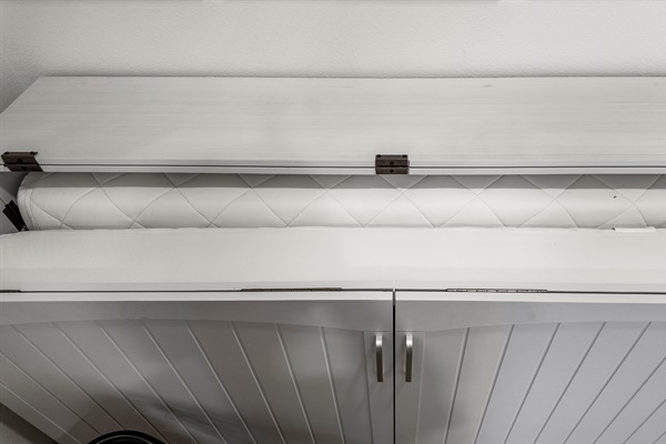 The Pleasure Pier Guest Suite murphy bed easily makes into a comfortable queen bed.