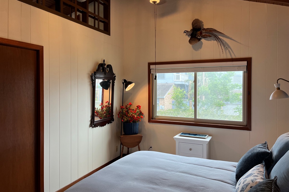 Master bedroom window view of the gardens and pergola below