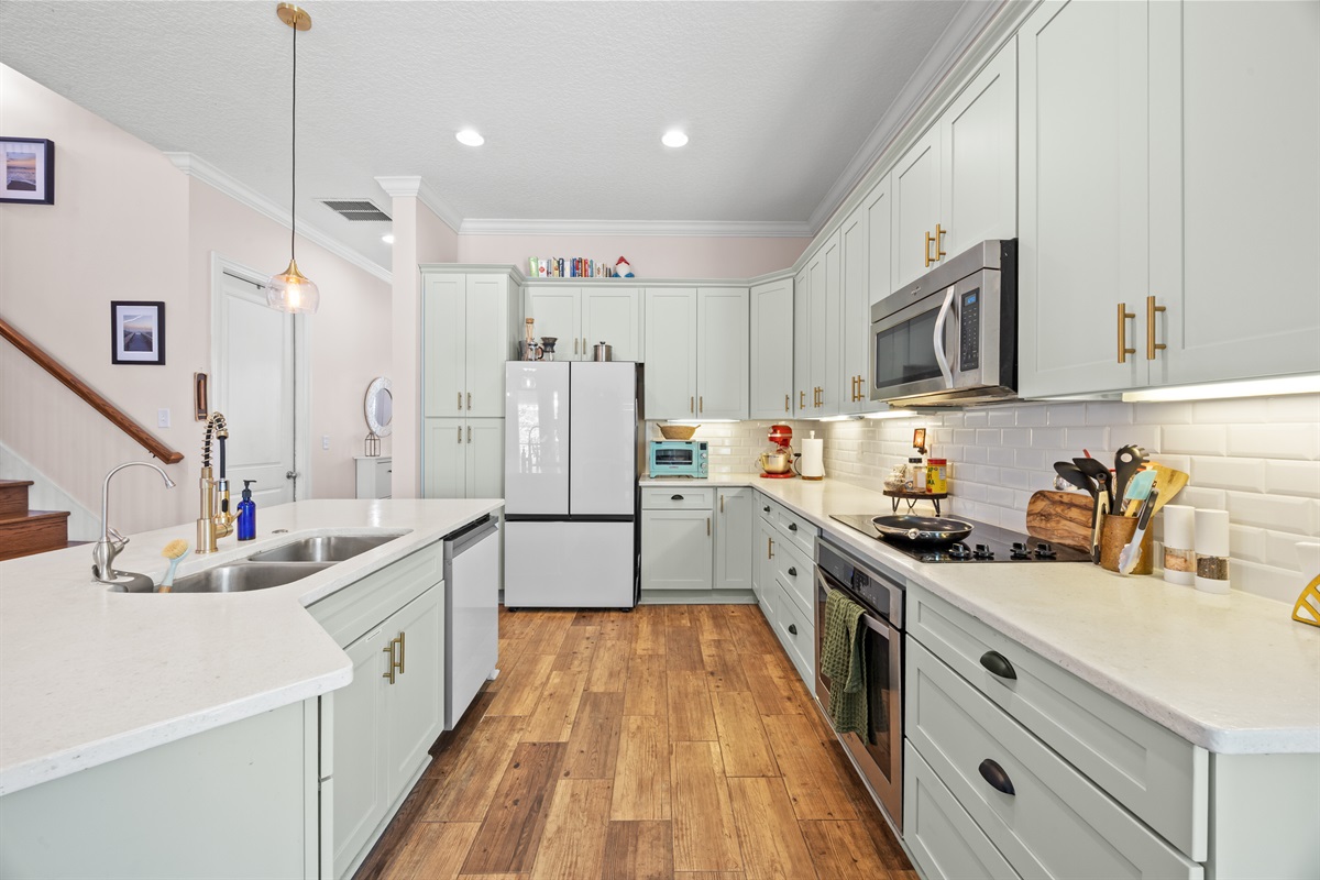 Kitchen with modern appliances and plenty of counter space for meal prep.