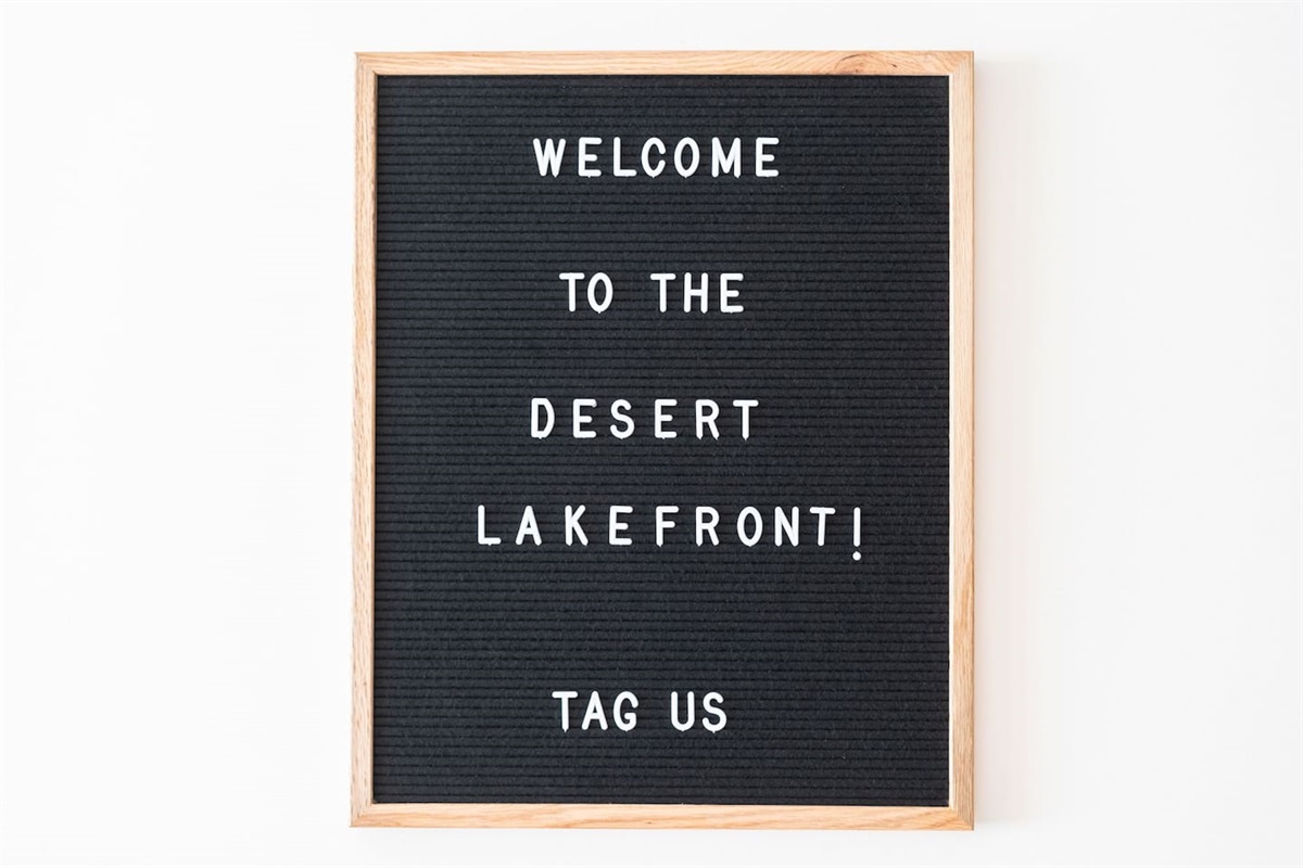 Welcome sign with a warm greeting to the Desert Lakefront — a personal touch that makes guests feel right at home.
