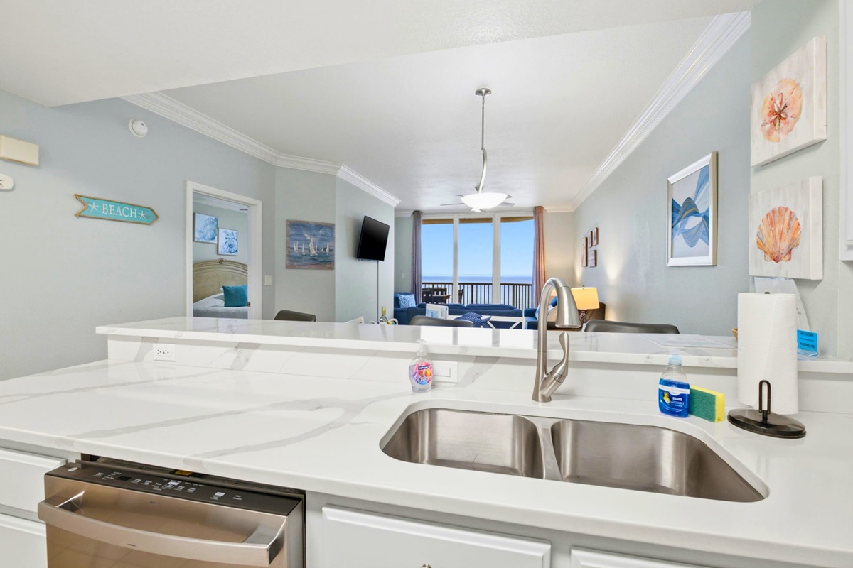 The kitchen offers plenty of counter space for prepping meals while still staying connected to the rest of the group.