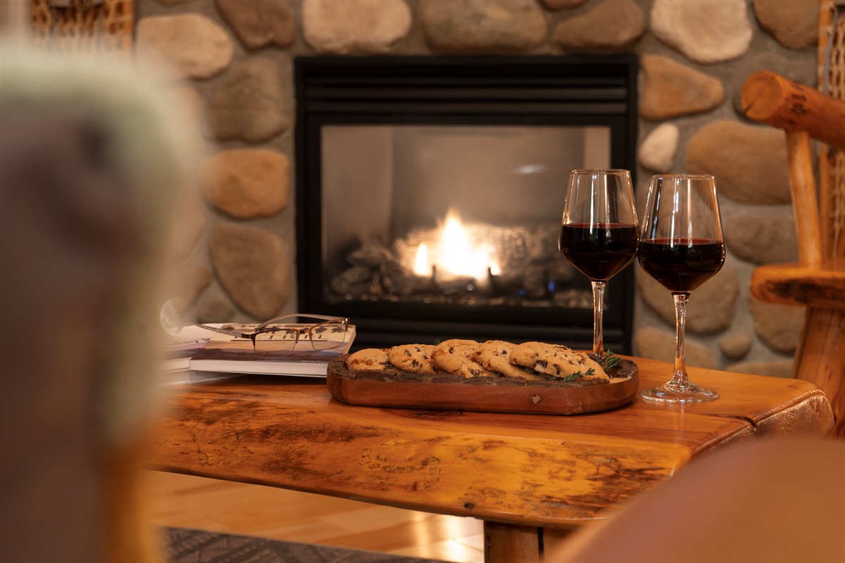 Find comfort and relaxation in the elegant living room with a radiant fireplace.