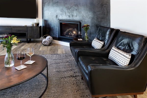 Glasses of wine, a glowing fire, and a pair of leather chairs that were made for long evenings. The perfect end to a day in wine country.